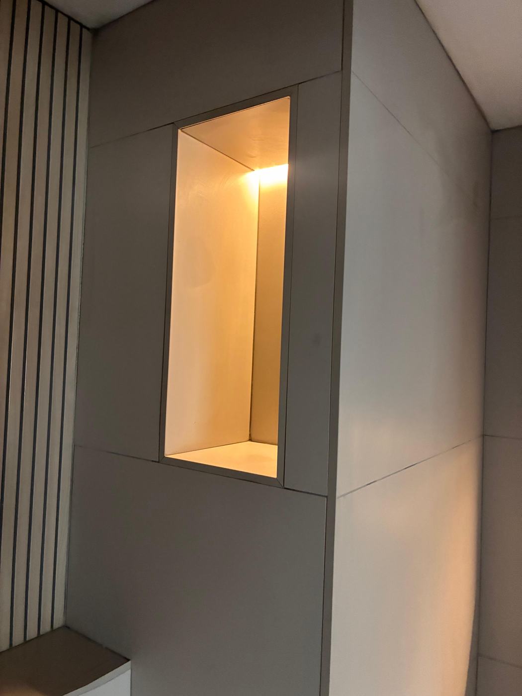 LED-lit recessed shower niche with mitred porcelain edges